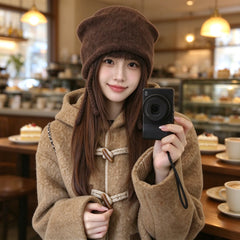 Coffee cat ear beanie worn with a duffle coat in a cafe