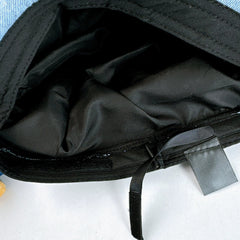 Inside of the denim beret showing the lining and size adjuster