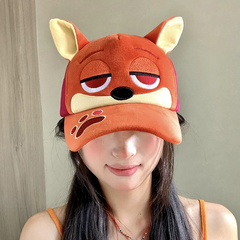 Plush fox baseball cap with embroidered eyes, nose, paw print, and 3D fox ears in soft velvety fabric.