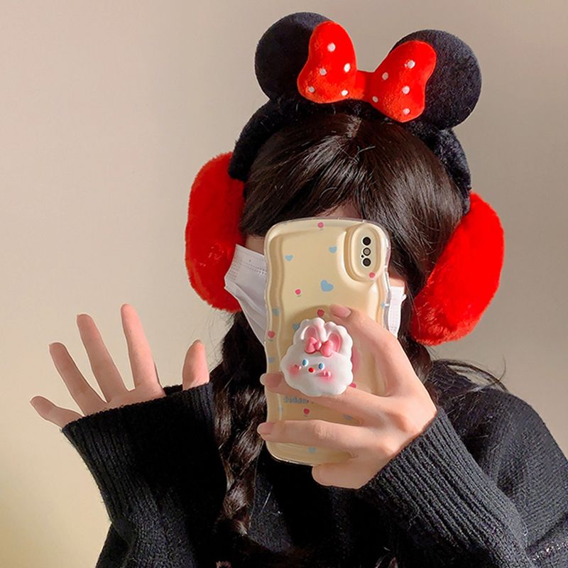 Fluffy plush ear muffs with red bow, soft black band, and cozy red ear covers – cute winter accessory for kids and teens