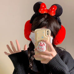 Fluffy plush ear muffs with red bow, soft black band, and cozy red ear covers – cute winter accessory for kids and teens
