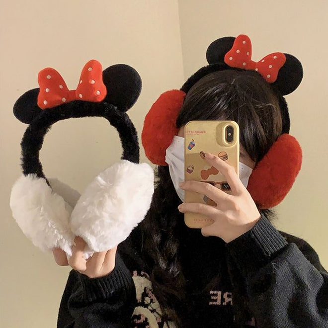 Fluffy plush ear muffs with red bow, soft black band, and cozy red ear covers – cute winter accessory for kids and teens