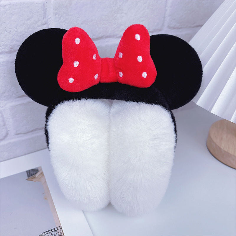 Fluffy plush ear muffs with red bow, soft black band, and cozy red ear covers – cute winter accessory for kids and teens