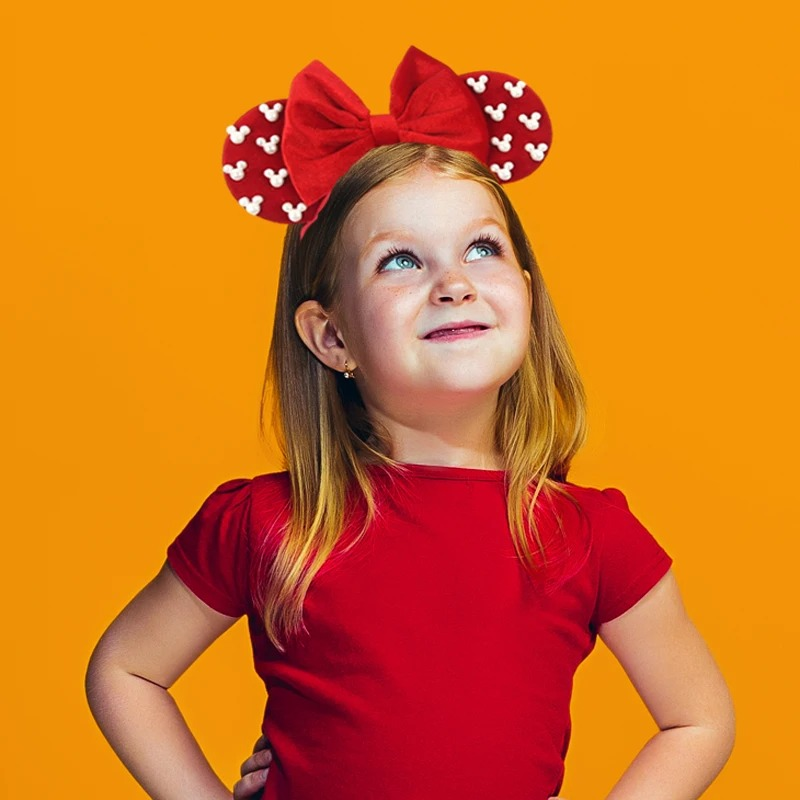 Disney-inspired holiday headband – colorful, stretchy, and adorable for Christmas parties and family photos.