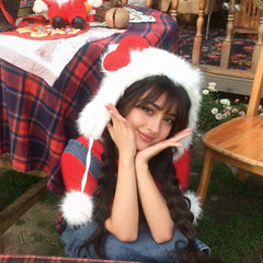 Fluffy Ear-Flap Winter Hat with Red Bow & Pompom Ties in white, worn close-up