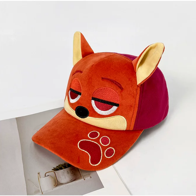Plush fox baseball cap with embroidered eyes, nose, paw print, and 3D fox ears in soft velvety fabric.